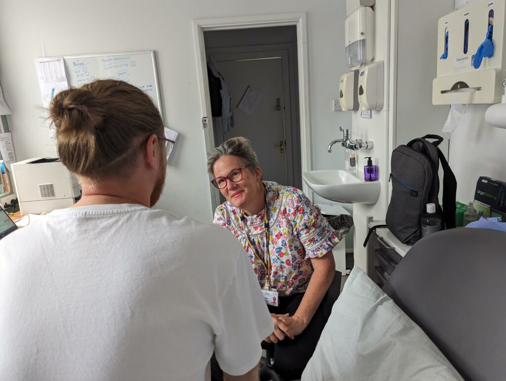 BDP's Nurse Kirsten Roberts meets with a patient in BDP's nursing room.